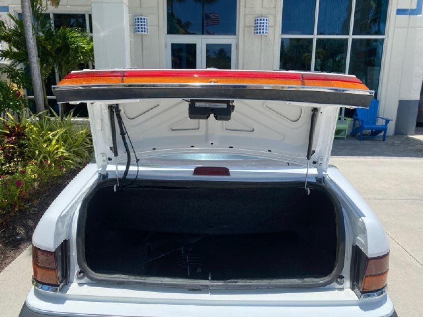 1993 White /Black Chrysler Lebaron CONV LX LOW MILES 26,305 (1C3XU5532PF) with an 3.0L SMFI 6-Cyl Engine engine, Automatic transmission, located at 4701 North Dixie Hwy, Pompano Beach, FL, 33064, (954) 422-2889, 26.240938, -80.123474 - OUR WEBPAGE FLORIDACARS1.COM HAS OVER 100 PHOTOS AND FREE CARFAX LINK 1993 Chrysler LeBaron Convertible 3.0L V6 F SOHC 12V Gasoline Front Wheel Drive Features ABS Brakes Air Conditioning Alloy Wheels AM/FM Stereo Automatic Transmission Cassette Player Cruise Control Leather Seats Power Locks Power S- Photo#92