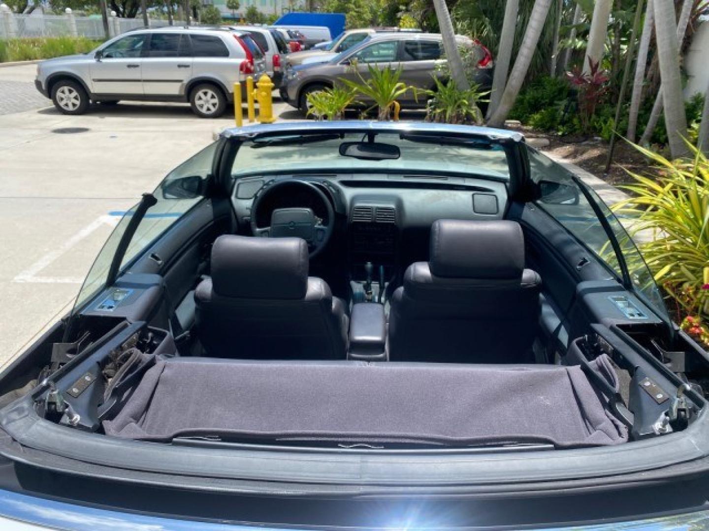 1993 White /Black Chrysler Lebaron CONV LX LOW MILES 26,305 (1C3XU5532PF) with an 3.0L SMFI 6-Cyl Engine engine, Automatic transmission, located at 4701 North Dixie Hwy, Pompano Beach, FL, 33064, (954) 422-2889, 26.240938, -80.123474 - OUR WEBPAGE FLORIDACARS1.COM HAS OVER 100 PHOTOS AND FREE CARFAX LINK 1993 Chrysler LeBaron Convertible 3.0L V6 F SOHC 12V Gasoline Front Wheel Drive Features ABS Brakes Air Conditioning Alloy Wheels AM/FM Stereo Automatic Transmission Cassette Player Cruise Control Leather Seats Power Locks Power S- Photo#99