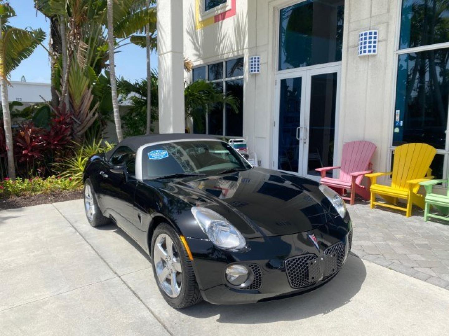 2008 Mysterious (Black) /Ebony Pontiac Solstice GXP 2.0 ECOTURBO LOW MILES 26,059 (1G2MG35X28Y) with an Turbo Ecotec 2.0L VVT DOHC 4-Cyl Aluminum Engine engine, Manual transmission, located at 4701 North Dixie Hwy, Pompano Beach, FL, 33064, (954) 422-2889, 26.240938, -80.123474 - OUR WEBPAGE FLORIDACARS1.COM HAS OVER 100 PHOTOS AND FREE CARFAX LINK 2008 Pontiac Solstice GXP Convertible 2.0L I4 F Gasoline 31 MPG Rear Wheel Drive Features ABS Brakes Air Conditioning Alloy Wheels AM/FM Stereo Auxiliary Audio Input CD Audio Convenience Package Cruise Control Leather Seats Manual- Photo#1