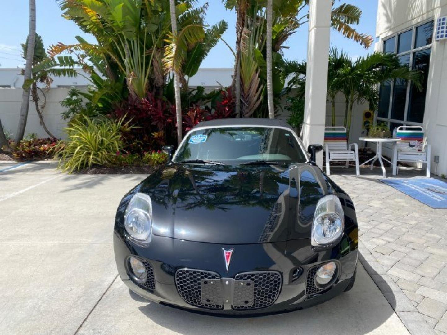 2008 Mysterious (Black) /Ebony Pontiac Solstice GXP 2.0 ECOTURBO LOW MILES 26,059 (1G2MG35X28Y) with an Turbo Ecotec 2.0L VVT DOHC 4-Cyl Aluminum Engine engine, Manual transmission, located at 4701 North Dixie Hwy, Pompano Beach, FL, 33064, (954) 422-2889, 26.240938, -80.123474 - OUR WEBPAGE FLORIDACARS1.COM HAS OVER 100 PHOTOS AND FREE CARFAX LINK 2008 Pontiac Solstice GXP Convertible 2.0L I4 F Gasoline 31 MPG Rear Wheel Drive Features ABS Brakes Air Conditioning Alloy Wheels AM/FM Stereo Auxiliary Audio Input CD Audio Convenience Package Cruise Control Leather Seats Manual- Photo#2