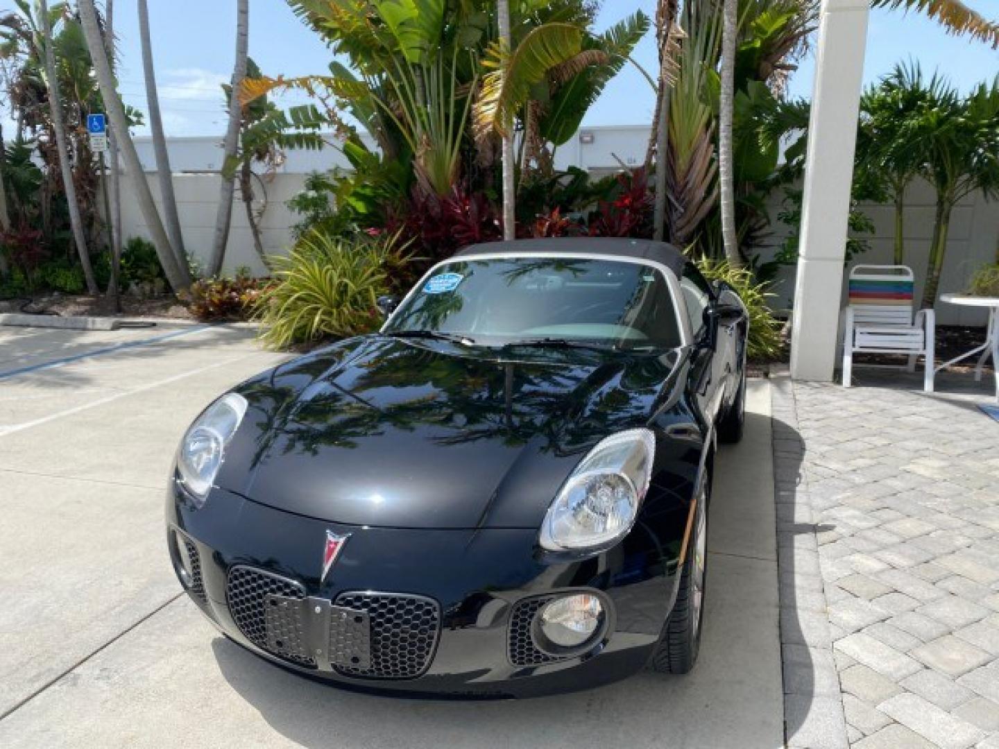 2008 Mysterious (Black) /Ebony Pontiac Solstice GXP 2.0 ECOTURBO LOW MILES 26,059 (1G2MG35X28Y) with an Turbo Ecotec 2.0L VVT DOHC 4-Cyl Aluminum Engine engine, Manual transmission, located at 4701 North Dixie Hwy, Pompano Beach, FL, 33064, (954) 422-2889, 26.240938, -80.123474 - OUR WEBPAGE FLORIDACARS1.COM HAS OVER 100 PHOTOS AND FREE CARFAX LINK 2008 Pontiac Solstice GXP Convertible 2.0L I4 F Gasoline 31 MPG Rear Wheel Drive Features ABS Brakes Air Conditioning Alloy Wheels AM/FM Stereo Auxiliary Audio Input CD Audio Convenience Package Cruise Control Leather Seats Manual- Photo#3