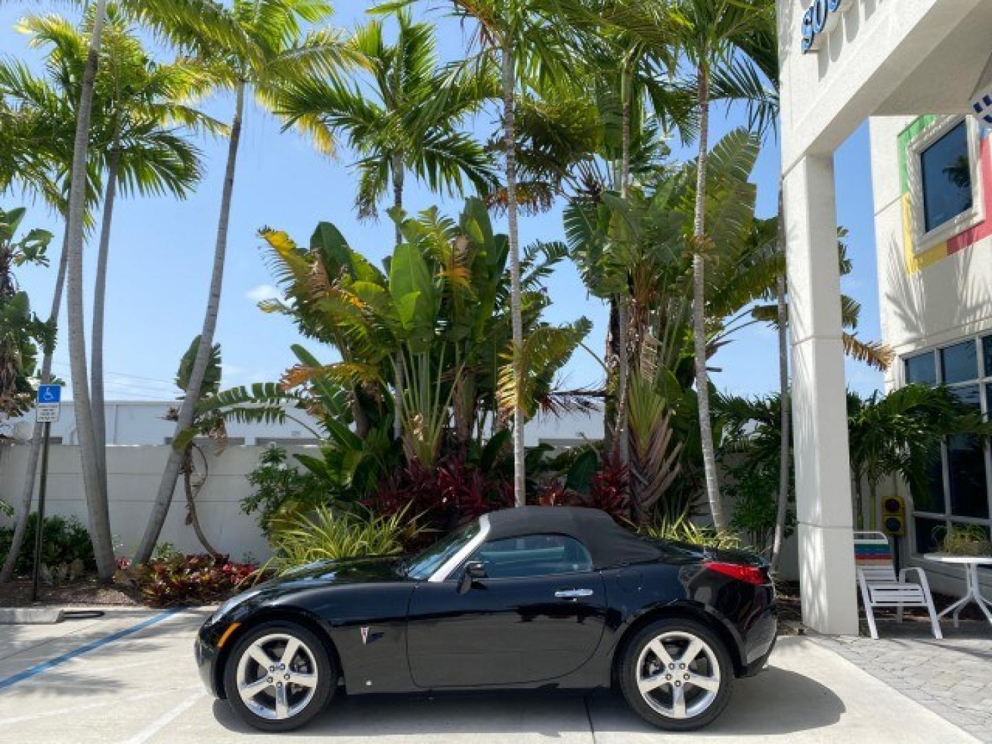 2008 Mysterious (Black) /Ebony Pontiac Solstice GXP 2.0 ECOTURBO LOW MILES 26,059 (1G2MG35X28Y) with an Turbo Ecotec 2.0L VVT DOHC 4-Cyl Aluminum Engine engine, Manual transmission, located at 4701 North Dixie Hwy, Pompano Beach, FL, 33064, (954) 422-2889, 26.240938, -80.123474 - OUR WEBPAGE FLORIDACARS1.COM HAS OVER 100 PHOTOS AND FREE CARFAX LINK 2008 Pontiac Solstice GXP Convertible 2.0L I4 F Gasoline 31 MPG Rear Wheel Drive Features ABS Brakes Air Conditioning Alloy Wheels AM/FM Stereo Auxiliary Audio Input CD Audio Convenience Package Cruise Control Leather Seats Manual- Photo#4