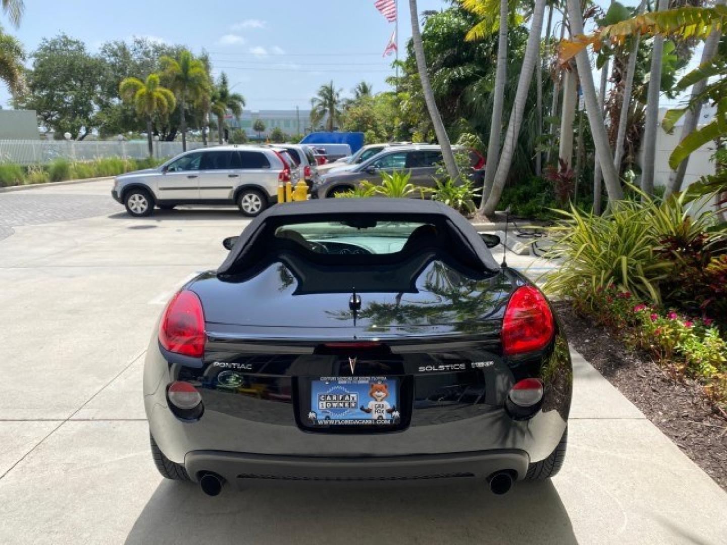 2008 Mysterious (Black) /Ebony Pontiac Solstice GXP 2.0 ECOTURBO LOW MILES 26,059 (1G2MG35X28Y) with an Turbo Ecotec 2.0L VVT DOHC 4-Cyl Aluminum Engine engine, Manual transmission, located at 4701 North Dixie Hwy, Pompano Beach, FL, 33064, (954) 422-2889, 26.240938, -80.123474 - OUR WEBPAGE FLORIDACARS1.COM HAS OVER 100 PHOTOS AND FREE CARFAX LINK 2008 Pontiac Solstice GXP Convertible 2.0L I4 F Gasoline 31 MPG Rear Wheel Drive Features ABS Brakes Air Conditioning Alloy Wheels AM/FM Stereo Auxiliary Audio Input CD Audio Convenience Package Cruise Control Leather Seats Manual- Photo#6