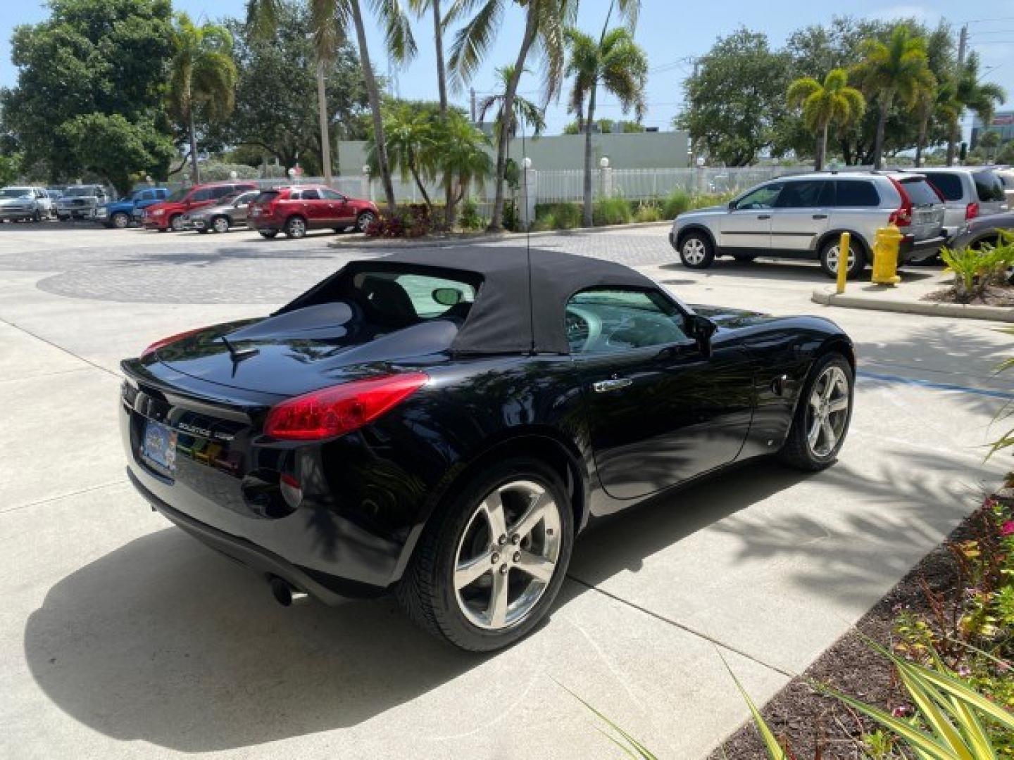 2008 Mysterious (Black) /Ebony Pontiac Solstice GXP 2.0 ECOTURBO LOW MILES 26,059 (1G2MG35X28Y) with an Turbo Ecotec 2.0L VVT DOHC 4-Cyl Aluminum Engine engine, Manual transmission, located at 4701 North Dixie Hwy, Pompano Beach, FL, 33064, (954) 422-2889, 26.240938, -80.123474 - OUR WEBPAGE FLORIDACARS1.COM HAS OVER 100 PHOTOS AND FREE CARFAX LINK 2008 Pontiac Solstice GXP Convertible 2.0L I4 F Gasoline 31 MPG Rear Wheel Drive Features ABS Brakes Air Conditioning Alloy Wheels AM/FM Stereo Auxiliary Audio Input CD Audio Convenience Package Cruise Control Leather Seats Manual- Photo#7