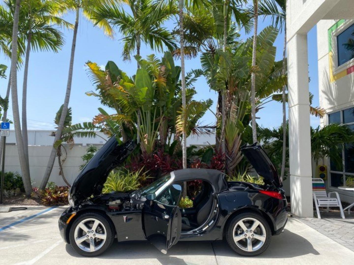 2008 Mysterious (Black) /Ebony Pontiac Solstice GXP 2.0 ECOTURBO LOW MILES 26,059 (1G2MG35X28Y) with an Turbo Ecotec 2.0L VVT DOHC 4-Cyl Aluminum Engine engine, Manual transmission, located at 4701 North Dixie Hwy, Pompano Beach, FL, 33064, (954) 422-2889, 26.240938, -80.123474 - OUR WEBPAGE FLORIDACARS1.COM HAS OVER 100 PHOTOS AND FREE CARFAX LINK 2008 Pontiac Solstice GXP Convertible 2.0L I4 F Gasoline 31 MPG Rear Wheel Drive Features ABS Brakes Air Conditioning Alloy Wheels AM/FM Stereo Auxiliary Audio Input CD Audio Convenience Package Cruise Control Leather Seats Manual- Photo#8