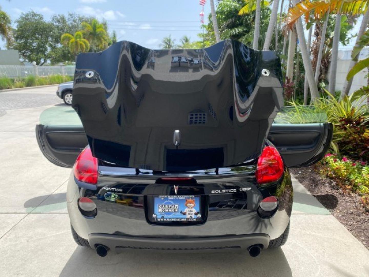 2008 Mysterious (Black) /Ebony Pontiac Solstice GXP 2.0 ECOTURBO LOW MILES 26,059 (1G2MG35X28Y) with an Turbo Ecotec 2.0L VVT DOHC 4-Cyl Aluminum Engine engine, Manual transmission, located at 4701 North Dixie Hwy, Pompano Beach, FL, 33064, (954) 422-2889, 26.240938, -80.123474 - OUR WEBPAGE FLORIDACARS1.COM HAS OVER 100 PHOTOS AND FREE CARFAX LINK 2008 Pontiac Solstice GXP Convertible 2.0L I4 F Gasoline 31 MPG Rear Wheel Drive Features ABS Brakes Air Conditioning Alloy Wheels AM/FM Stereo Auxiliary Audio Input CD Audio Convenience Package Cruise Control Leather Seats Manual- Photo#15