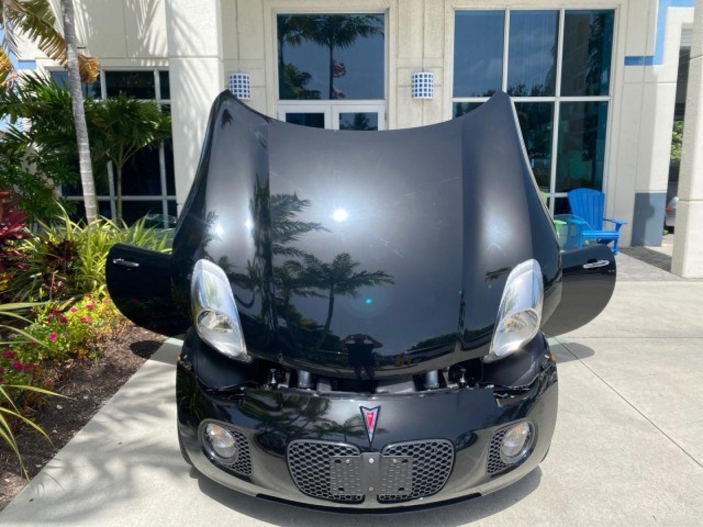 2008 Mysterious (Black) /Ebony Pontiac Solstice GXP 2.0 ECOTURBO LOW MILES 26,059 (1G2MG35X28Y) with an Turbo Ecotec 2.0L VVT DOHC 4-Cyl Aluminum Engine engine, Manual transmission, located at 4701 North Dixie Hwy, Pompano Beach, FL, 33064, (954) 422-2889, 26.240938, -80.123474 - OUR WEBPAGE FLORIDACARS1.COM HAS OVER 100 PHOTOS AND FREE CARFAX LINK 2008 Pontiac Solstice GXP Convertible 2.0L I4 F Gasoline 31 MPG Rear Wheel Drive Features ABS Brakes Air Conditioning Alloy Wheels AM/FM Stereo Auxiliary Audio Input CD Audio Convenience Package Cruise Control Leather Seats Manual- Photo#17