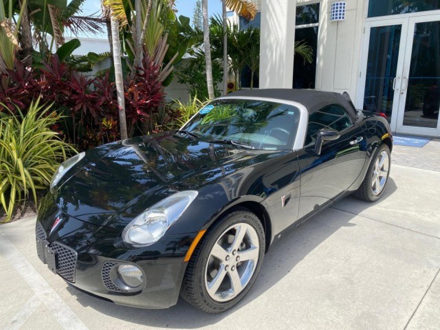 2008 Mysterious (Black) /Ebony Pontiac Solstice GXP 2.0 ECOTURBO LOW MILES 26,059 (1G2MG35X28Y) with an Turbo Ecotec 2.0L VVT DOHC 4-Cyl Aluminum Engine engine, Manual transmission, located at 4701 North Dixie Hwy, Pompano Beach, FL, 33064, (954) 422-2889, 26.240938, -80.123474 - OUR WEBPAGE FLORIDACARS1.COM HAS OVER 100 PHOTOS AND FREE CARFAX LINK 2008 Pontiac Solstice GXP Convertible 2.0L I4 F Gasoline 31 MPG Rear Wheel Drive Features ABS Brakes Air Conditioning Alloy Wheels AM/FM Stereo Auxiliary Audio Input CD Audio Convenience Package Cruise Control Leather Seats Manual- Photo#29