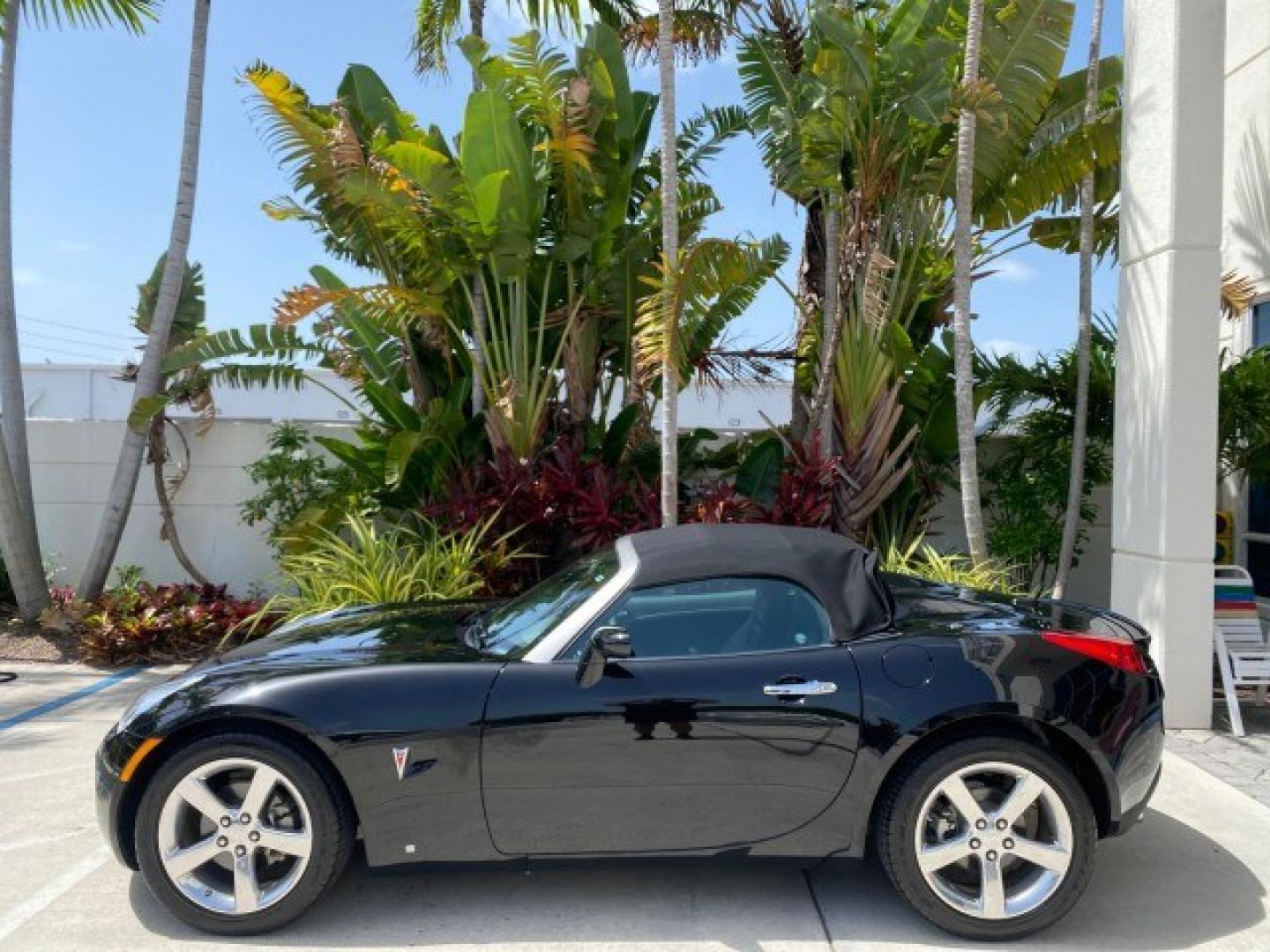 2008 Mysterious (Black) /Ebony Pontiac Solstice GXP 2.0 ECOTURBO LOW MILES 26,059 (1G2MG35X28Y) with an Turbo Ecotec 2.0L VVT DOHC 4-Cyl Aluminum Engine engine, Manual transmission, located at 4701 North Dixie Hwy, Pompano Beach, FL, 33064, (954) 422-2889, 26.240938, -80.123474 - OUR WEBPAGE FLORIDACARS1.COM HAS OVER 100 PHOTOS AND FREE CARFAX LINK 2008 Pontiac Solstice GXP Convertible 2.0L I4 F Gasoline 31 MPG Rear Wheel Drive Features ABS Brakes Air Conditioning Alloy Wheels AM/FM Stereo Auxiliary Audio Input CD Audio Convenience Package Cruise Control Leather Seats Manual- Photo#31