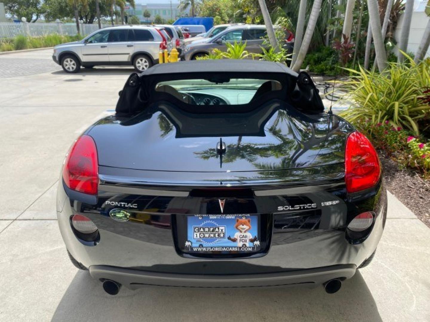 2008 Mysterious (Black) /Ebony Pontiac Solstice GXP 2.0 ECOTURBO LOW MILES 26,059 (1G2MG35X28Y) with an Turbo Ecotec 2.0L VVT DOHC 4-Cyl Aluminum Engine engine, Manual transmission, located at 4701 North Dixie Hwy, Pompano Beach, FL, 33064, (954) 422-2889, 26.240938, -80.123474 - OUR WEBPAGE FLORIDACARS1.COM HAS OVER 100 PHOTOS AND FREE CARFAX LINK 2008 Pontiac Solstice GXP Convertible 2.0L I4 F Gasoline 31 MPG Rear Wheel Drive Features ABS Brakes Air Conditioning Alloy Wheels AM/FM Stereo Auxiliary Audio Input CD Audio Convenience Package Cruise Control Leather Seats Manual- Photo#35