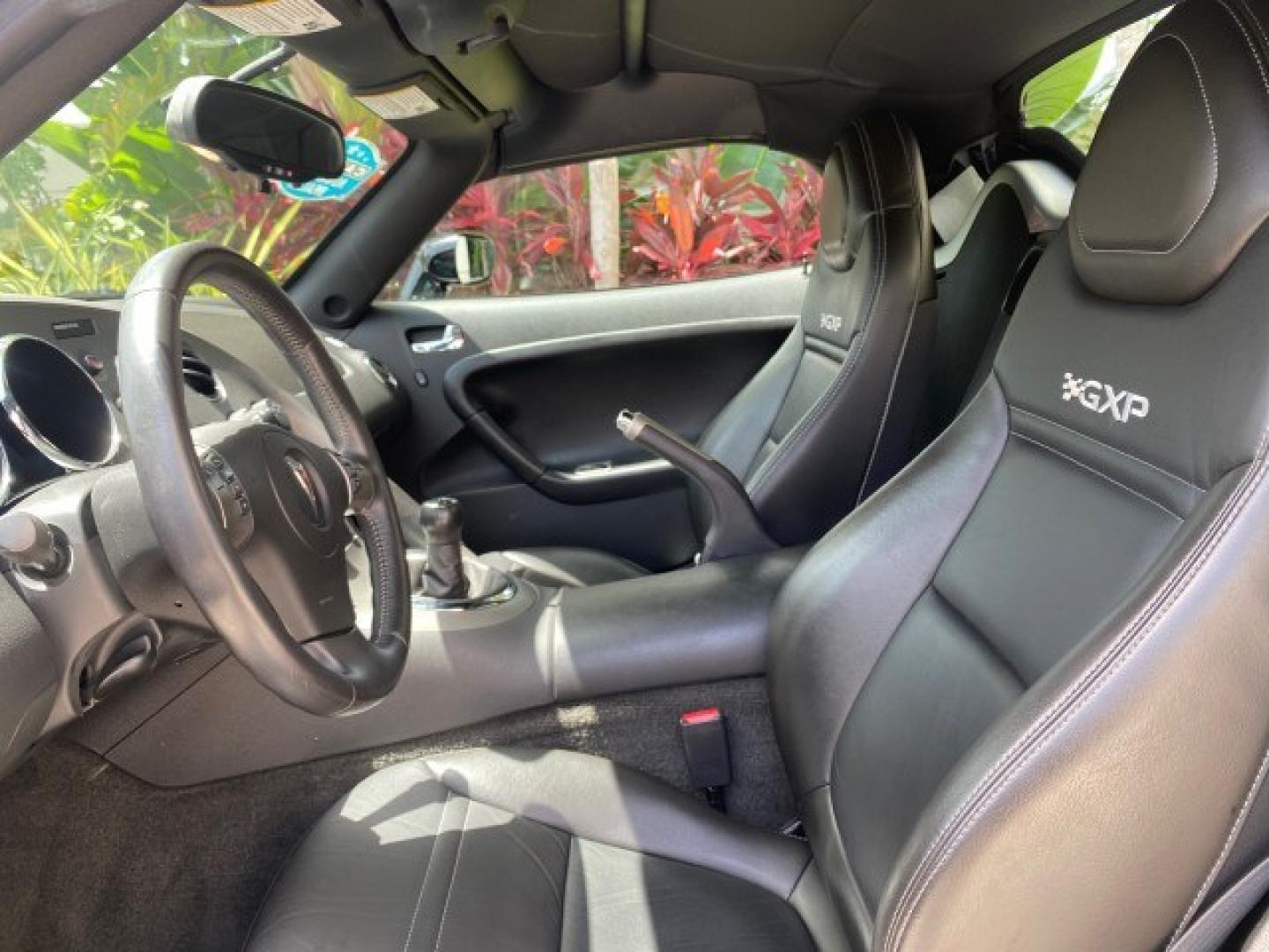 2008 Mysterious (Black) /Ebony Pontiac Solstice GXP 2.0 ECOTURBO LOW MILES 26,059 (1G2MG35X28Y) with an Turbo Ecotec 2.0L VVT DOHC 4-Cyl Aluminum Engine engine, Manual transmission, located at 4701 North Dixie Hwy, Pompano Beach, FL, 33064, (954) 422-2889, 26.240938, -80.123474 - OUR WEBPAGE FLORIDACARS1.COM HAS OVER 100 PHOTOS AND FREE CARFAX LINK 2008 Pontiac Solstice GXP Convertible 2.0L I4 F Gasoline 31 MPG Rear Wheel Drive Features ABS Brakes Air Conditioning Alloy Wheels AM/FM Stereo Auxiliary Audio Input CD Audio Convenience Package Cruise Control Leather Seats Manual- Photo#44