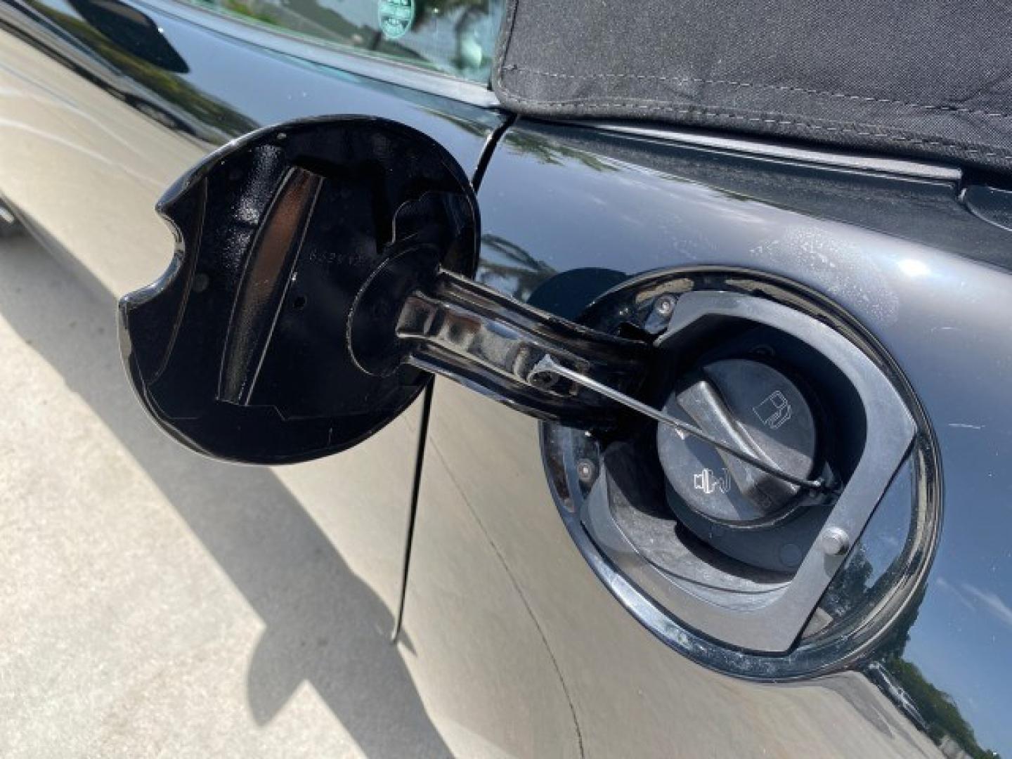 2008 Mysterious (Black) /Ebony Pontiac Solstice GXP 2.0 ECOTURBO LOW MILES 26,059 (1G2MG35X28Y) with an Turbo Ecotec 2.0L VVT DOHC 4-Cyl Aluminum Engine engine, Manual transmission, located at 4701 North Dixie Hwy, Pompano Beach, FL, 33064, (954) 422-2889, 26.240938, -80.123474 - OUR WEBPAGE FLORIDACARS1.COM HAS OVER 100 PHOTOS AND FREE CARFAX LINK 2008 Pontiac Solstice GXP Convertible 2.0L I4 F Gasoline 31 MPG Rear Wheel Drive Features ABS Brakes Air Conditioning Alloy Wheels AM/FM Stereo Auxiliary Audio Input CD Audio Convenience Package Cruise Control Leather Seats Manual- Photo#75