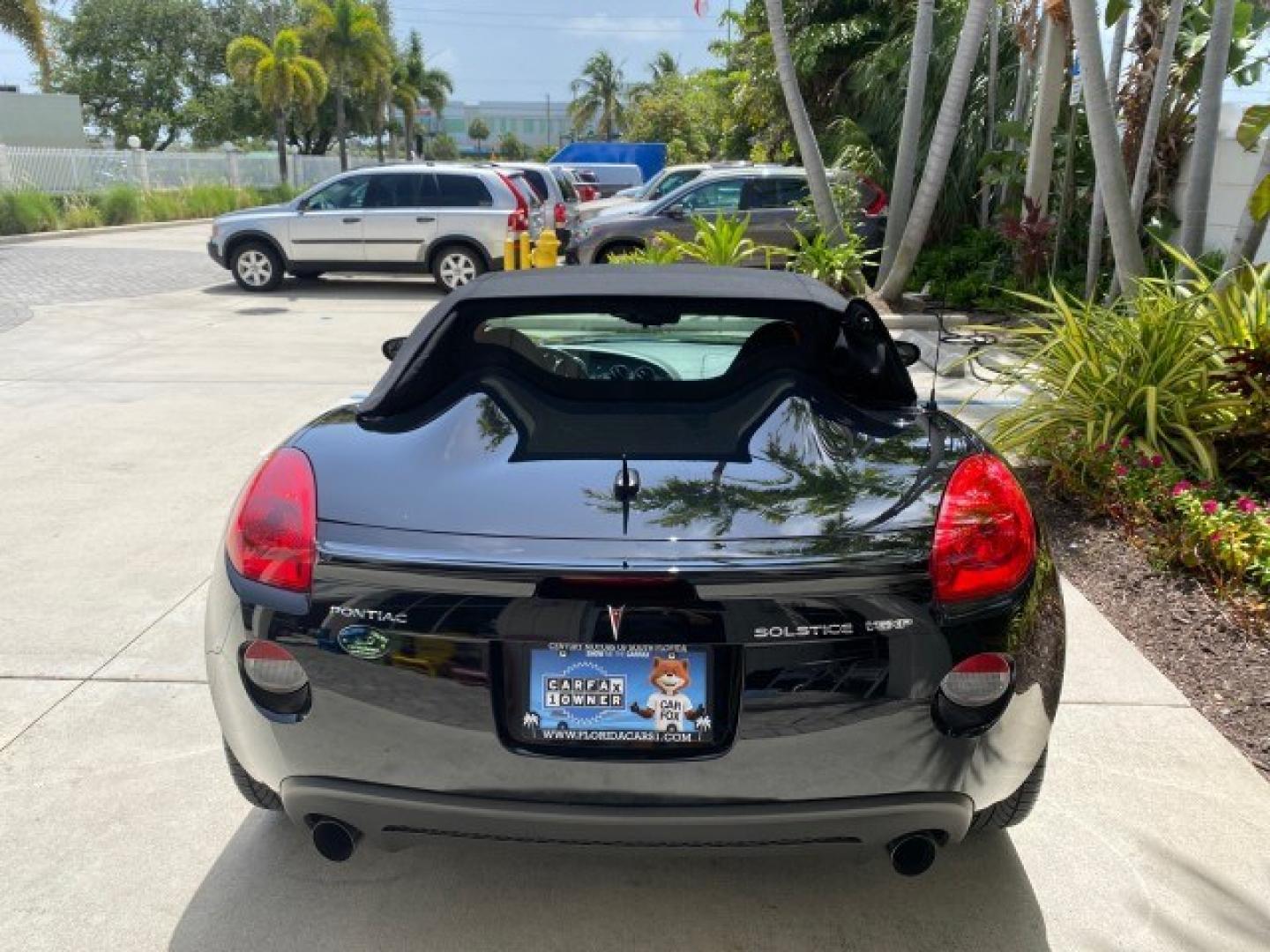 2008 Mysterious (Black) /Ebony Pontiac Solstice GXP 2.0 ECOTURBO LOW MILES 26,059 (1G2MG35X28Y) with an Turbo Ecotec 2.0L VVT DOHC 4-Cyl Aluminum Engine engine, Manual transmission, located at 4701 North Dixie Hwy, Pompano Beach, FL, 33064, (954) 422-2889, 26.240938, -80.123474 - OUR WEBPAGE FLORIDACARS1.COM HAS OVER 100 PHOTOS AND FREE CARFAX LINK 2008 Pontiac Solstice GXP Convertible 2.0L I4 F Gasoline 31 MPG Rear Wheel Drive Features ABS Brakes Air Conditioning Alloy Wheels AM/FM Stereo Auxiliary Audio Input CD Audio Convenience Package Cruise Control Leather Seats Manual- Photo#78