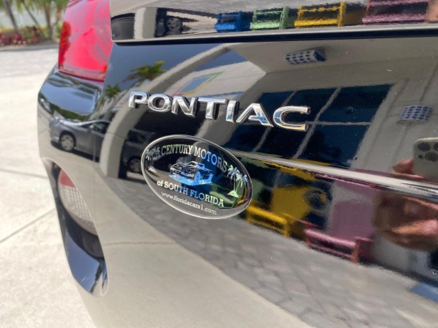 2008 Mysterious (Black) /Ebony Pontiac Solstice GXP 2.0 ECOTURBO LOW MILES 26,059 (1G2MG35X28Y) with an Turbo Ecotec 2.0L VVT DOHC 4-Cyl Aluminum Engine engine, Manual transmission, located at 4701 North Dixie Hwy, Pompano Beach, FL, 33064, (954) 422-2889, 26.240938, -80.123474 - OUR WEBPAGE FLORIDACARS1.COM HAS OVER 100 PHOTOS AND FREE CARFAX LINK 2008 Pontiac Solstice GXP Convertible 2.0L I4 F Gasoline 31 MPG Rear Wheel Drive Features ABS Brakes Air Conditioning Alloy Wheels AM/FM Stereo Auxiliary Audio Input CD Audio Convenience Package Cruise Control Leather Seats Manual- Photo#79