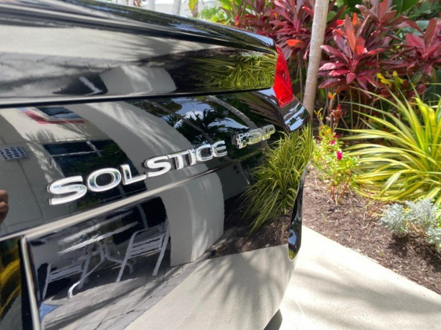 2008 Mysterious (Black) /Ebony Pontiac Solstice GXP 2.0 ECOTURBO LOW MILES 26,059 (1G2MG35X28Y) with an Turbo Ecotec 2.0L VVT DOHC 4-Cyl Aluminum Engine engine, Manual transmission, located at 4701 North Dixie Hwy, Pompano Beach, FL, 33064, (954) 422-2889, 26.240938, -80.123474 - OUR WEBPAGE FLORIDACARS1.COM HAS OVER 100 PHOTOS AND FREE CARFAX LINK 2008 Pontiac Solstice GXP Convertible 2.0L I4 F Gasoline 31 MPG Rear Wheel Drive Features ABS Brakes Air Conditioning Alloy Wheels AM/FM Stereo Auxiliary Audio Input CD Audio Convenience Package Cruise Control Leather Seats Manual- Photo#81