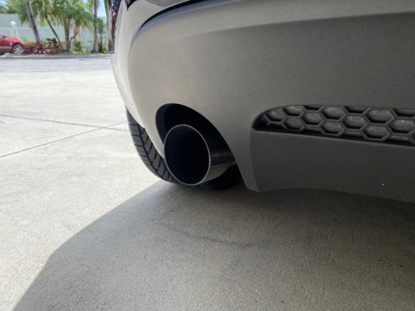 2008 Mysterious (Black) /Ebony Pontiac Solstice GXP 2.0 ECOTURBO LOW MILES 26,059 (1G2MG35X28Y) with an Turbo Ecotec 2.0L VVT DOHC 4-Cyl Aluminum Engine engine, Manual transmission, located at 4701 North Dixie Hwy, Pompano Beach, FL, 33064, (954) 422-2889, 26.240938, -80.123474 - OUR WEBPAGE FLORIDACARS1.COM HAS OVER 100 PHOTOS AND FREE CARFAX LINK 2008 Pontiac Solstice GXP Convertible 2.0L I4 F Gasoline 31 MPG Rear Wheel Drive Features ABS Brakes Air Conditioning Alloy Wheels AM/FM Stereo Auxiliary Audio Input CD Audio Convenience Package Cruise Control Leather Seats Manual- Photo#83