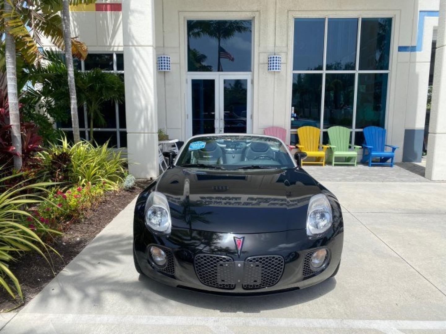 2008 Mysterious (Black) /Ebony Pontiac Solstice GXP 2.0 ECOTURBO LOW MILES 26,059 (1G2MG35X28Y) with an Turbo Ecotec 2.0L VVT DOHC 4-Cyl Aluminum Engine engine, Manual transmission, located at 4701 North Dixie Hwy, Pompano Beach, FL, 33064, (954) 422-2889, 26.240938, -80.123474 - OUR WEBPAGE FLORIDACARS1.COM HAS OVER 100 PHOTOS AND FREE CARFAX LINK 2008 Pontiac Solstice GXP Convertible 2.0L I4 F Gasoline 31 MPG Rear Wheel Drive Features ABS Brakes Air Conditioning Alloy Wheels AM/FM Stereo Auxiliary Audio Input CD Audio Convenience Package Cruise Control Leather Seats Manual- Photo#84