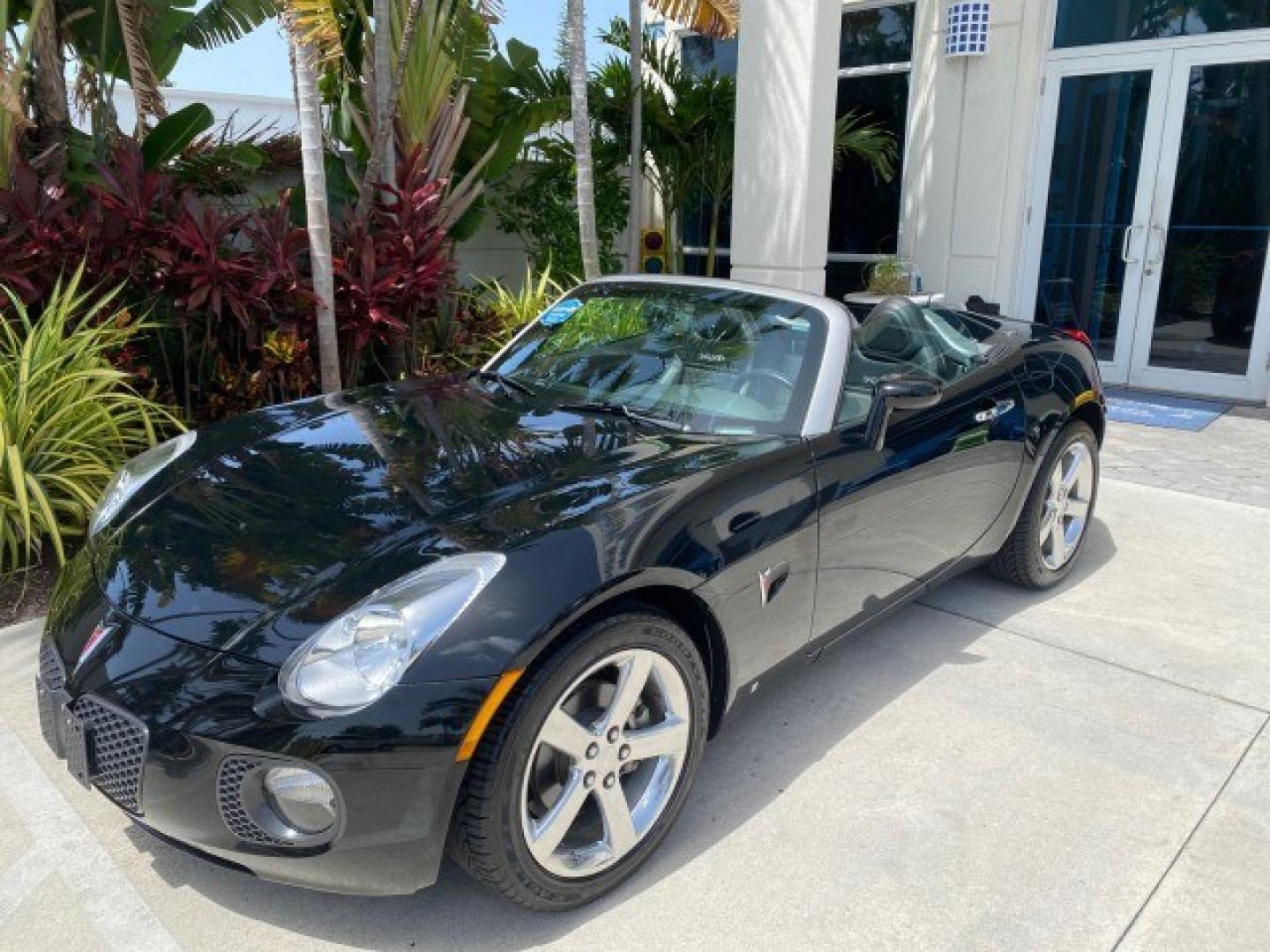2008 Mysterious (Black) /Ebony Pontiac Solstice GXP 2.0 ECOTURBO LOW MILES 26,059 (1G2MG35X28Y) with an Turbo Ecotec 2.0L VVT DOHC 4-Cyl Aluminum Engine engine, Manual transmission, located at 4701 North Dixie Hwy, Pompano Beach, FL, 33064, (954) 422-2889, 26.240938, -80.123474 - OUR WEBPAGE FLORIDACARS1.COM HAS OVER 100 PHOTOS AND FREE CARFAX LINK 2008 Pontiac Solstice GXP Convertible 2.0L I4 F Gasoline 31 MPG Rear Wheel Drive Features ABS Brakes Air Conditioning Alloy Wheels AM/FM Stereo Auxiliary Audio Input CD Audio Convenience Package Cruise Control Leather Seats Manual- Photo#87