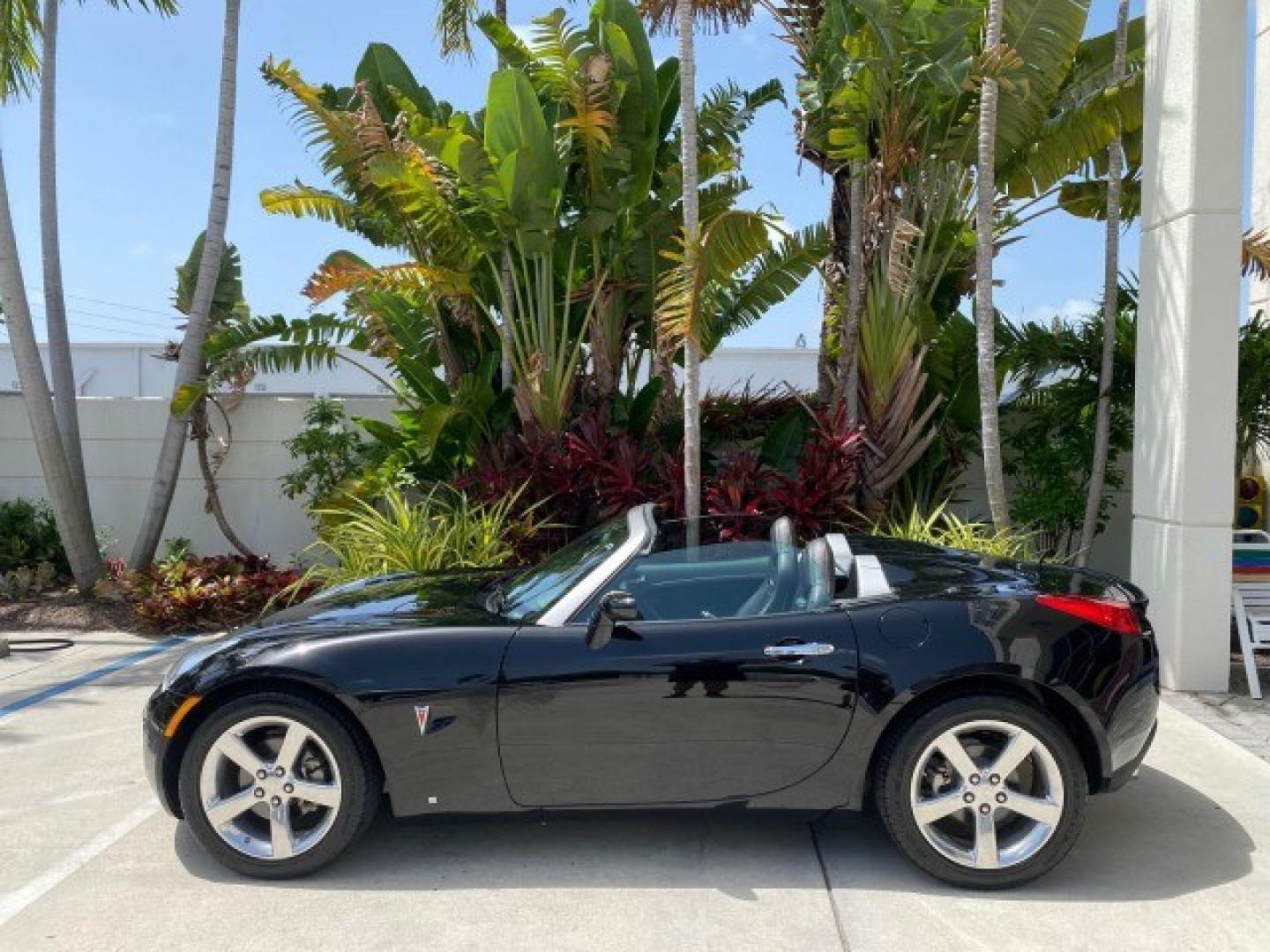 2008 Mysterious (Black) /Ebony Pontiac Solstice GXP 2.0 ECOTURBO LOW MILES 26,059 (1G2MG35X28Y) with an Turbo Ecotec 2.0L VVT DOHC 4-Cyl Aluminum Engine engine, Manual transmission, located at 4701 North Dixie Hwy, Pompano Beach, FL, 33064, (954) 422-2889, 26.240938, -80.123474 - OUR WEBPAGE FLORIDACARS1.COM HAS OVER 100 PHOTOS AND FREE CARFAX LINK 2008 Pontiac Solstice GXP Convertible 2.0L I4 F Gasoline 31 MPG Rear Wheel Drive Features ABS Brakes Air Conditioning Alloy Wheels AM/FM Stereo Auxiliary Audio Input CD Audio Convenience Package Cruise Control Leather Seats Manual- Photo#88