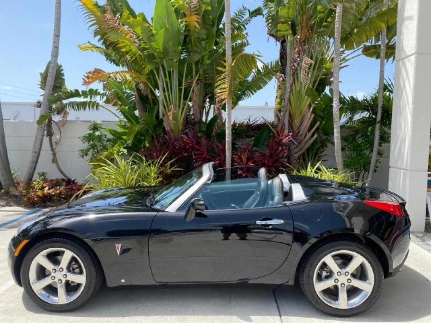 2008 Mysterious (Black) /Ebony Pontiac Solstice GXP 2.0 ECOTURBO LOW MILES 26,059 (1G2MG35X28Y) with an Turbo Ecotec 2.0L VVT DOHC 4-Cyl Aluminum Engine engine, Manual transmission, located at 4701 North Dixie Hwy, Pompano Beach, FL, 33064, (954) 422-2889, 26.240938, -80.123474 - OUR WEBPAGE FLORIDACARS1.COM HAS OVER 100 PHOTOS AND FREE CARFAX LINK 2008 Pontiac Solstice GXP Convertible 2.0L I4 F Gasoline 31 MPG Rear Wheel Drive Features ABS Brakes Air Conditioning Alloy Wheels AM/FM Stereo Auxiliary Audio Input CD Audio Convenience Package Cruise Control Leather Seats Manual- Photo#89