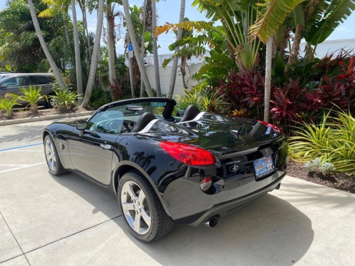 2008 Mysterious (Black) /Ebony Pontiac Solstice GXP 2.0 ECOTURBO LOW MILES 26,059 (1G2MG35X28Y) with an Turbo Ecotec 2.0L VVT DOHC 4-Cyl Aluminum Engine engine, Manual transmission, located at 4701 North Dixie Hwy, Pompano Beach, FL, 33064, (954) 422-2889, 26.240938, -80.123474 - OUR WEBPAGE FLORIDACARS1.COM HAS OVER 100 PHOTOS AND FREE CARFAX LINK 2008 Pontiac Solstice GXP Convertible 2.0L I4 F Gasoline 31 MPG Rear Wheel Drive Features ABS Brakes Air Conditioning Alloy Wheels AM/FM Stereo Auxiliary Audio Input CD Audio Convenience Package Cruise Control Leather Seats Manual- Photo#90