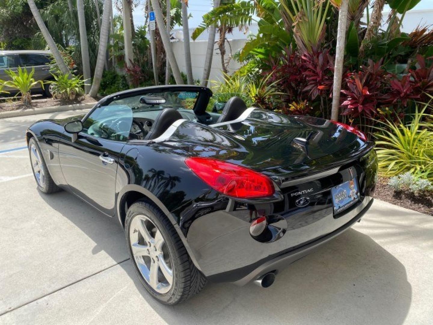 2008 Mysterious (Black) /Ebony Pontiac Solstice GXP 2.0 ECOTURBO LOW MILES 26,059 (1G2MG35X28Y) with an Turbo Ecotec 2.0L VVT DOHC 4-Cyl Aluminum Engine engine, Manual transmission, located at 4701 North Dixie Hwy, Pompano Beach, FL, 33064, (954) 422-2889, 26.240938, -80.123474 - OUR WEBPAGE FLORIDACARS1.COM HAS OVER 100 PHOTOS AND FREE CARFAX LINK 2008 Pontiac Solstice GXP Convertible 2.0L I4 F Gasoline 31 MPG Rear Wheel Drive Features ABS Brakes Air Conditioning Alloy Wheels AM/FM Stereo Auxiliary Audio Input CD Audio Convenience Package Cruise Control Leather Seats Manual- Photo#91