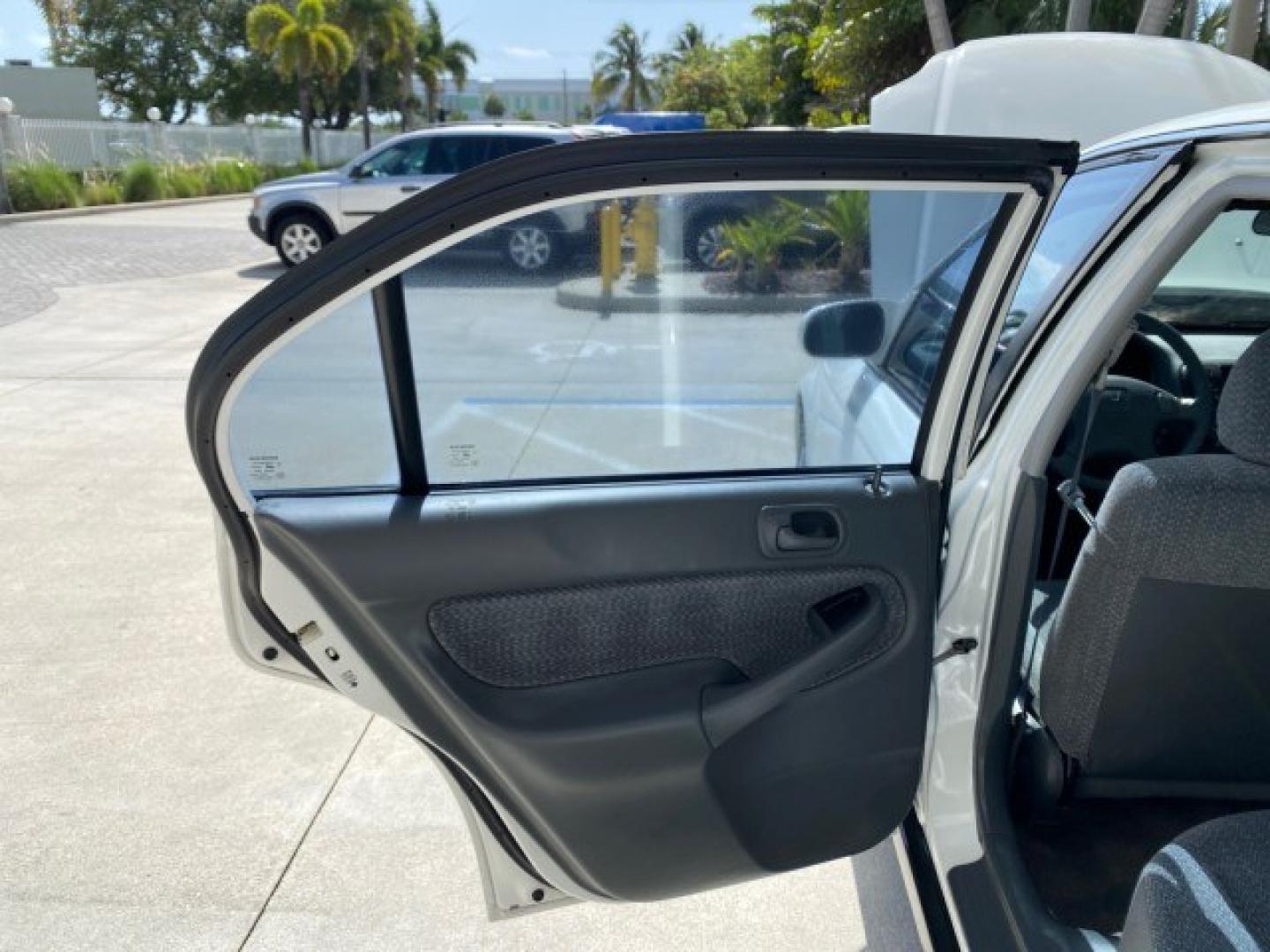 2000 Taffeta White /Gray Honda Civic EX LOW MILES 45,406 (1HGEJ8642YL) with an 1.6L SOHC VTEC 16-Valve I4 Engine engine, Automatic transmission, located at 4701 North Dixie Hwy, Pompano Beach, FL, 33064, (954) 422-2889, 26.240938, -80.123474 - OUR WEBPAGE FLORIDACARS1.COM HAS OVER 100 PHOTOS AND FREE CARFAX LINK 2000 Honda Civic EX Sedan 4 DR 1.6L I4 F 16V Gasoline 35 MPG Front Wheel Drive Features ABS Brakes Air Conditioning AM/FM Stereo Automatic Transmission CD Audio Cruise Control Power Locks Power Mirrors Power Windows Rear Defroster- Photo#13