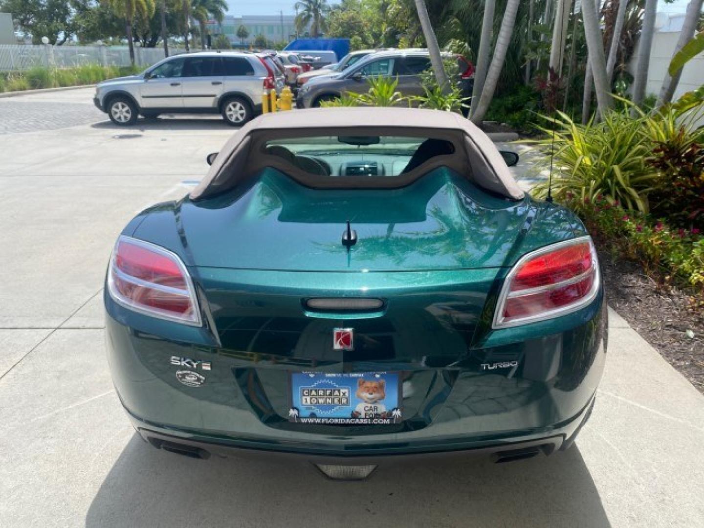 2008 Forest Green /Tan Saturn Sky AUTO TURBO Red Line LOW MILES 3,949 (1G8MG35X48Y) with an Turbocharged And Intercooled Ecotec 2.0L VVT DOHC 4-Cyl Aluminum Engine engine, Automatic transmission, located at 4701 North Dixie Hwy, Pompano Beach, FL, 33064, (954) 422-2889, 26.240938, -80.123474 - OUR WEBPAGE FLORIDACARS1.COM HAS OVER 100 PHOTOS AND FREE CARFAX LINK 2008 Saturn SKY Red Line Turbo All Original Paint Collectors Welcome Convertible 2.0L I4 F DOHC Gasoline 31 MPG Rear Wheel Drive Features ABS Brakes Air Conditioning Alloy Wheels AM/FM Stereo Automatic Transmission CD Audio Cruise- Photo#6