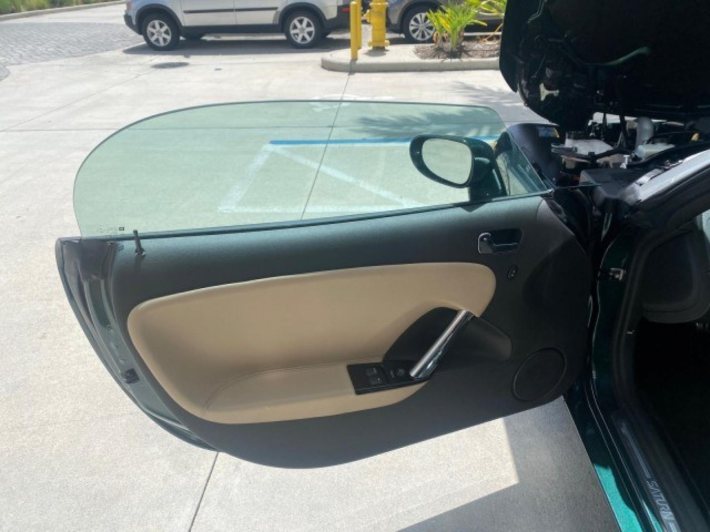 2008 Forest Green /Tan Saturn Sky AUTO TURBO Red Line LOW MILES 3,949 (1G8MG35X48Y) with an Turbocharged And Intercooled Ecotec 2.0L VVT DOHC 4-Cyl Aluminum Engine engine, Automatic transmission, located at 4701 North Dixie Hwy, Pompano Beach, FL, 33064, (954) 422-2889, 26.240938, -80.123474 - OUR WEBPAGE FLORIDACARS1.COM HAS OVER 100 PHOTOS AND FREE CARFAX LINK 2008 Saturn SKY Red Line Turbo All Original Paint Collectors Welcome Convertible 2.0L I4 F DOHC Gasoline 31 MPG Rear Wheel Drive Features ABS Brakes Air Conditioning Alloy Wheels AM/FM Stereo Automatic Transmission CD Audio Cruise- Photo#9