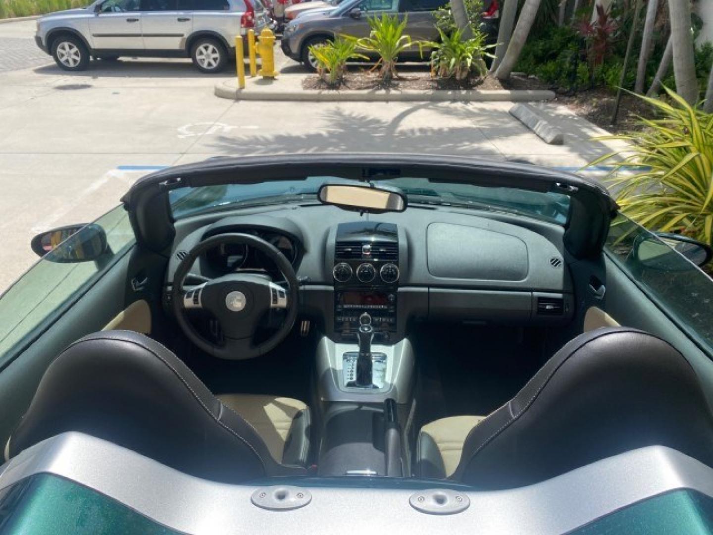 2008 Forest Green /Tan Saturn Sky AUTO TURBO Red Line LOW MILES 3,949 (1G8MG35X48Y) with an Turbocharged And Intercooled Ecotec 2.0L VVT DOHC 4-Cyl Aluminum Engine engine, Automatic transmission, located at 4701 North Dixie Hwy, Pompano Beach, FL, 33064, (954) 422-2889, 26.240938, -80.123474 - OUR WEBPAGE FLORIDACARS1.COM HAS OVER 100 PHOTOS AND FREE CARFAX LINK 2008 Saturn SKY Red Line Turbo All Original Paint Collectors Welcome Convertible 2.0L I4 F DOHC Gasoline 31 MPG Rear Wheel Drive Features ABS Brakes Air Conditioning Alloy Wheels AM/FM Stereo Automatic Transmission CD Audio Cruise- Photo#95