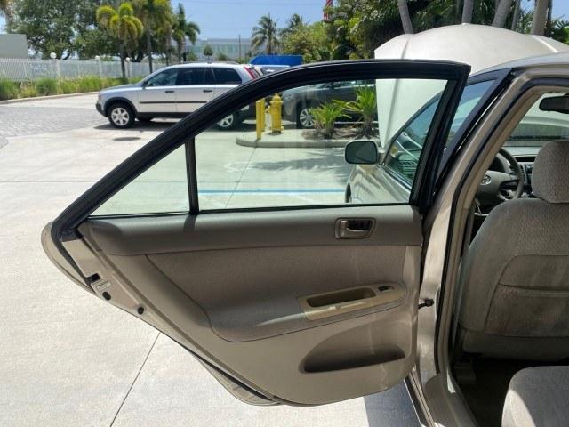 2004 Desert Sand Mica /Stone Toyota Camry LE LOW MILES 58,925 1 OWNER (4T1BE32K04U) with an 2.4L DOHC MPFI Vvti 16-Valve 4-Cyl Engine engine, Automatic transmission, located at 4701 North Dixie Hwy, Pompano Beach, FL, 33064, (954) 422-2889, 26.240938, -80.123474 - OUR WEBPAGE FLORIDACARS1.COM HAS OVER 100 PHOTOS AND FREE CARFAX LINK 2004 Toyota Camry LE 1 OWNER Sedan 4 DR 2.4L I4 F DOHC 16V Gasoline 32 MPG Front Wheel Drive Features Air Conditioning AM/FM Stereo Automatic Transmission Cassette Player CD Audio Cloth Seats Cruise Control Power Locks Power Mirro- Photo#13