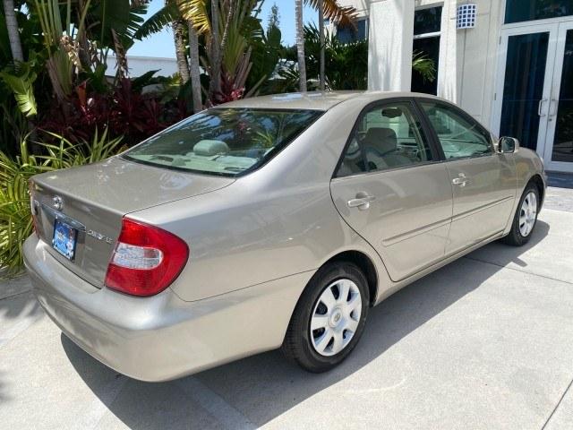 2004 Desert Sand Mica /Stone Toyota Camry LE LOW MILES 58,925 1 OWNER (4T1BE32K04U) with an 2.4L DOHC MPFI Vvti 16-Valve 4-Cyl Engine engine, Automatic transmission, located at 4701 North Dixie Hwy, Pompano Beach, FL, 33064, (954) 422-2889, 26.240938, -80.123474 - OUR WEBPAGE FLORIDACARS1.COM HAS OVER 100 PHOTOS AND FREE CARFAX LINK 2004 Toyota Camry LE 1 OWNER Sedan 4 DR 2.4L I4 F DOHC 16V Gasoline 32 MPG Front Wheel Drive Features Air Conditioning AM/FM Stereo Automatic Transmission Cassette Player CD Audio Cloth Seats Cruise Control Power Locks Power Mirro- Photo#97