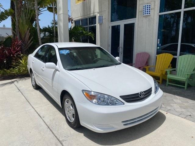 2003 Super White /Stone Toyota Camry LE LOW MILES 61,005 (4T1BF32K63U) with an 3.0L DOHC 24-Valve V6 Engine engine, Automatic transmission, located at 4701 North Dixie Hwy, Pompano Beach, FL, 33064, (954) 422-2889, 26.240938, -80.123474 - OUR WEBPAGE FLORIDACARS1.COM HAS OVER 100 PHOTOS AND FREE CARFAX LINK 2003 Toyota Camry LE Sedan 4 DR 3.0L V6 F DOHC 24V Gasoline 28 MPG Front Wheel Drive Features ABS Brakes Air Conditioning Alloy Wheels AM/FM Stereo Automatic Transmission Cassette Player CD Audio Cloth Seats Cruise Control Power L- Photo#1