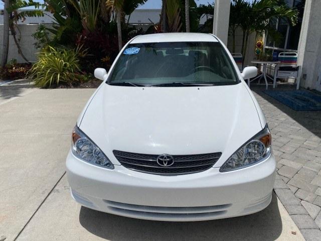 2003 Super White /Stone Toyota Camry LE LOW MILES 61,005 (4T1BF32K63U) with an 3.0L DOHC 24-Valve V6 Engine engine, Automatic transmission, located at 4701 North Dixie Hwy, Pompano Beach, FL, 33064, (954) 422-2889, 26.240938, -80.123474 - OUR WEBPAGE FLORIDACARS1.COM HAS OVER 100 PHOTOS AND FREE CARFAX LINK 2003 Toyota Camry LE Sedan 4 DR 3.0L V6 F DOHC 24V Gasoline 28 MPG Front Wheel Drive Features ABS Brakes Air Conditioning Alloy Wheels AM/FM Stereo Automatic Transmission Cassette Player CD Audio Cloth Seats Cruise Control Power L- Photo#2
