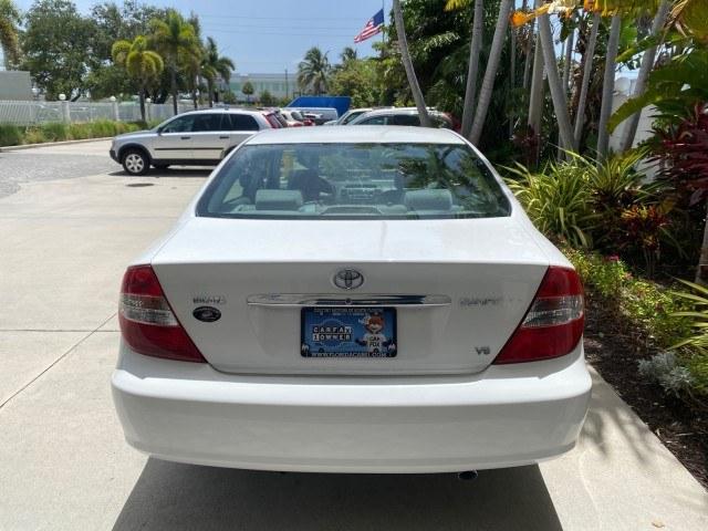 2003 Super White /Stone Toyota Camry LE LOW MILES 61,005 (4T1BF32K63U) with an 3.0L DOHC 24-Valve V6 Engine engine, Automatic transmission, located at 4701 North Dixie Hwy, Pompano Beach, FL, 33064, (954) 422-2889, 26.240938, -80.123474 - OUR WEBPAGE FLORIDACARS1.COM HAS OVER 100 PHOTOS AND FREE CARFAX LINK 2003 Toyota Camry LE Sedan 4 DR 3.0L V6 F DOHC 24V Gasoline 28 MPG Front Wheel Drive Features ABS Brakes Air Conditioning Alloy Wheels AM/FM Stereo Automatic Transmission Cassette Player CD Audio Cloth Seats Cruise Control Power L- Photo#6