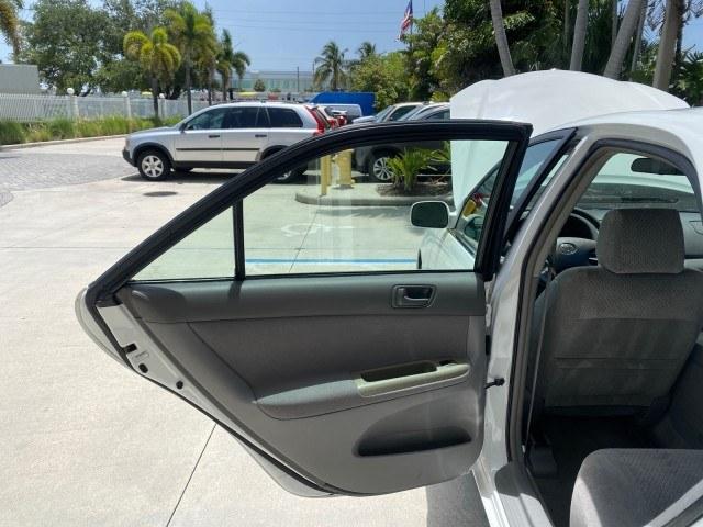 2003 Super White /Stone Toyota Camry LE LOW MILES 61,005 (4T1BF32K63U) with an 3.0L DOHC 24-Valve V6 Engine engine, Automatic transmission, located at 4701 North Dixie Hwy, Pompano Beach, FL, 33064, (954) 422-2889, 26.240938, -80.123474 - OUR WEBPAGE FLORIDACARS1.COM HAS OVER 100 PHOTOS AND FREE CARFAX LINK 2003 Toyota Camry LE Sedan 4 DR 3.0L V6 F DOHC 24V Gasoline 28 MPG Front Wheel Drive Features ABS Brakes Air Conditioning Alloy Wheels AM/FM Stereo Automatic Transmission Cassette Player CD Audio Cloth Seats Cruise Control Power L- Photo#13