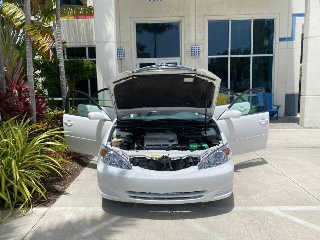 2003 Super White /Stone Toyota Camry LE LOW MILES 61,005 (4T1BF32K63U) with an 3.0L DOHC 24-Valve V6 Engine engine, Automatic transmission, located at 4701 North Dixie Hwy, Pompano Beach, FL, 33064, (954) 422-2889, 26.240938, -80.123474 - OUR WEBPAGE FLORIDACARS1.COM HAS OVER 100 PHOTOS AND FREE CARFAX LINK 2003 Toyota Camry LE Sedan 4 DR 3.0L V6 F DOHC 24V Gasoline 28 MPG Front Wheel Drive Features ABS Brakes Air Conditioning Alloy Wheels AM/FM Stereo Automatic Transmission Cassette Player CD Audio Cloth Seats Cruise Control Power L- Photo#16