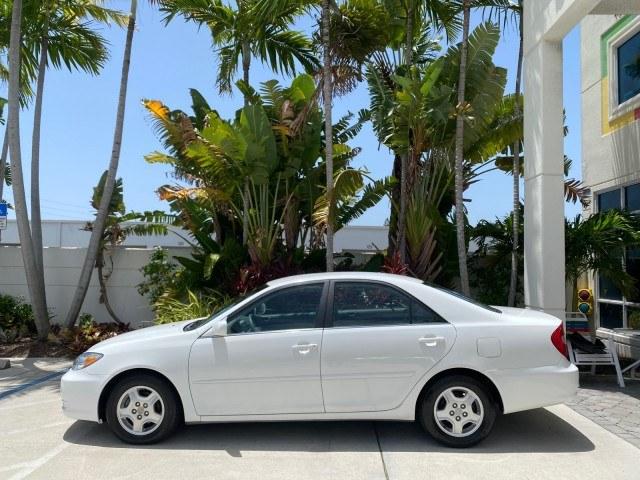 2003 Super White /Stone Toyota Camry LE LOW MILES 61,005 (4T1BF32K63U) with an 3.0L DOHC 24-Valve V6 Engine engine, Automatic transmission, located at 4701 North Dixie Hwy, Pompano Beach, FL, 33064, (954) 422-2889, 26.240938, -80.123474 - OUR WEBPAGE FLORIDACARS1.COM HAS OVER 100 PHOTOS AND FREE CARFAX LINK 2003 Toyota Camry LE Sedan 4 DR 3.0L V6 F DOHC 24V Gasoline 28 MPG Front Wheel Drive Features ABS Brakes Air Conditioning Alloy Wheels AM/FM Stereo Automatic Transmission Cassette Player CD Audio Cloth Seats Cruise Control Power L- Photo#30