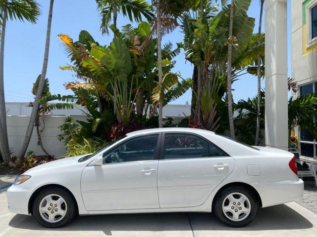 2003 Super White /Stone Toyota Camry LE LOW MILES 61,005 (4T1BF32K63U) with an 3.0L DOHC 24-Valve V6 Engine engine, Automatic transmission, located at 4701 North Dixie Hwy, Pompano Beach, FL, 33064, (954) 422-2889, 26.240938, -80.123474 - OUR WEBPAGE FLORIDACARS1.COM HAS OVER 100 PHOTOS AND FREE CARFAX LINK 2003 Toyota Camry LE Sedan 4 DR 3.0L V6 F DOHC 24V Gasoline 28 MPG Front Wheel Drive Features ABS Brakes Air Conditioning Alloy Wheels AM/FM Stereo Automatic Transmission Cassette Player CD Audio Cloth Seats Cruise Control Power L- Photo#31