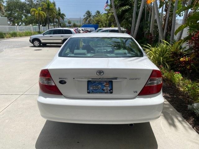 2003 Super White /Stone Toyota Camry LE LOW MILES 61,005 (4T1BF32K63U) with an 3.0L DOHC 24-Valve V6 Engine engine, Automatic transmission, located at 4701 North Dixie Hwy, Pompano Beach, FL, 33064, (954) 422-2889, 26.240938, -80.123474 - OUR WEBPAGE FLORIDACARS1.COM HAS OVER 100 PHOTOS AND FREE CARFAX LINK 2003 Toyota Camry LE Sedan 4 DR 3.0L V6 F DOHC 24V Gasoline 28 MPG Front Wheel Drive Features ABS Brakes Air Conditioning Alloy Wheels AM/FM Stereo Automatic Transmission Cassette Player CD Audio Cloth Seats Cruise Control Power L- Photo#34