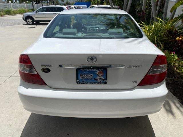 2003 Super White /Stone Toyota Camry LE LOW MILES 61,005 (4T1BF32K63U) with an 3.0L DOHC 24-Valve V6 Engine engine, Automatic transmission, located at 4701 North Dixie Hwy, Pompano Beach, FL, 33064, (954) 422-2889, 26.240938, -80.123474 - OUR WEBPAGE FLORIDACARS1.COM HAS OVER 100 PHOTOS AND FREE CARFAX LINK 2003 Toyota Camry LE Sedan 4 DR 3.0L V6 F DOHC 24V Gasoline 28 MPG Front Wheel Drive Features ABS Brakes Air Conditioning Alloy Wheels AM/FM Stereo Automatic Transmission Cassette Player CD Audio Cloth Seats Cruise Control Power L- Photo#35
