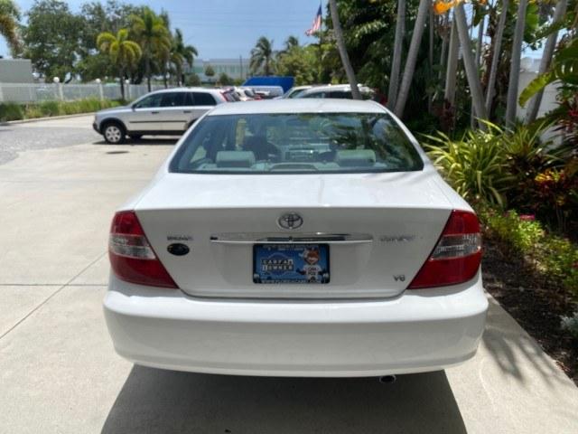 2003 Super White /Stone Toyota Camry LE LOW MILES 61,005 (4T1BF32K63U) with an 3.0L DOHC 24-Valve V6 Engine engine, Automatic transmission, located at 4701 North Dixie Hwy, Pompano Beach, FL, 33064, (954) 422-2889, 26.240938, -80.123474 - OUR WEBPAGE FLORIDACARS1.COM HAS OVER 100 PHOTOS AND FREE CARFAX LINK 2003 Toyota Camry LE Sedan 4 DR 3.0L V6 F DOHC 24V Gasoline 28 MPG Front Wheel Drive Features ABS Brakes Air Conditioning Alloy Wheels AM/FM Stereo Automatic Transmission Cassette Player CD Audio Cloth Seats Cruise Control Power L- Photo#84