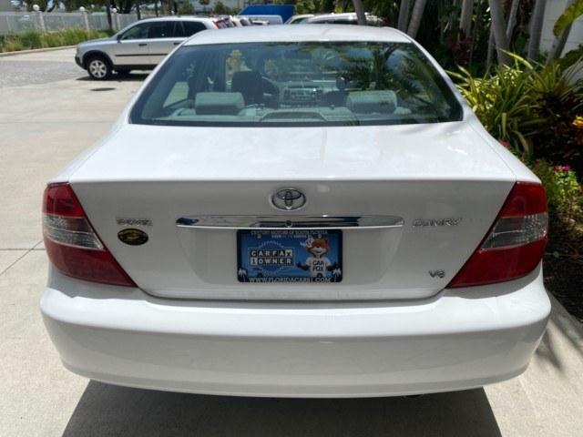 2003 Super White /Stone Toyota Camry LE LOW MILES 61,005 (4T1BF32K63U) with an 3.0L DOHC 24-Valve V6 Engine engine, Automatic transmission, located at 4701 North Dixie Hwy, Pompano Beach, FL, 33064, (954) 422-2889, 26.240938, -80.123474 - OUR WEBPAGE FLORIDACARS1.COM HAS OVER 100 PHOTOS AND FREE CARFAX LINK 2003 Toyota Camry LE Sedan 4 DR 3.0L V6 F DOHC 24V Gasoline 28 MPG Front Wheel Drive Features ABS Brakes Air Conditioning Alloy Wheels AM/FM Stereo Automatic Transmission Cassette Player CD Audio Cloth Seats Cruise Control Power L- Photo#85
