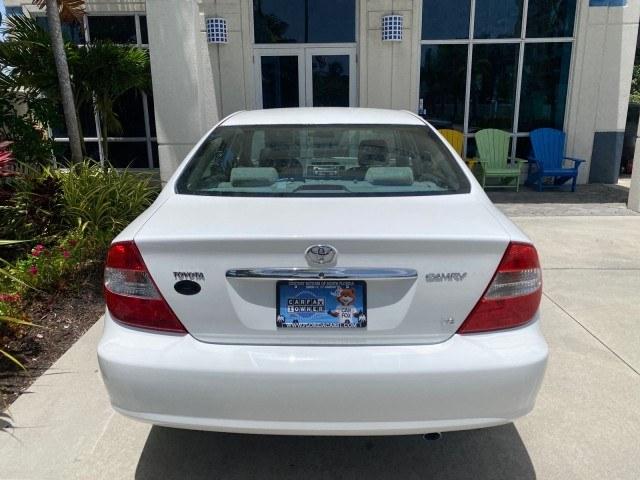 2003 Super White /Stone Toyota Camry LE LOW MILES 61,005 (4T1BF32K63U) with an 3.0L DOHC 24-Valve V6 Engine engine, Automatic transmission, located at 4701 North Dixie Hwy, Pompano Beach, FL, 33064, (954) 422-2889, 26.240938, -80.123474 - OUR WEBPAGE FLORIDACARS1.COM HAS OVER 100 PHOTOS AND FREE CARFAX LINK 2003 Toyota Camry LE Sedan 4 DR 3.0L V6 F DOHC 24V Gasoline 28 MPG Front Wheel Drive Features ABS Brakes Air Conditioning Alloy Wheels AM/FM Stereo Automatic Transmission Cassette Player CD Audio Cloth Seats Cruise Control Power L- Photo#94