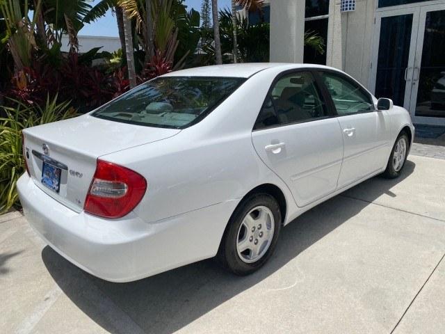 2003 Super White /Stone Toyota Camry LE LOW MILES 61,005 (4T1BF32K63U) with an 3.0L DOHC 24-Valve V6 Engine engine, Automatic transmission, located at 4701 North Dixie Hwy, Pompano Beach, FL, 33064, (954) 422-2889, 26.240938, -80.123474 - OUR WEBPAGE FLORIDACARS1.COM HAS OVER 100 PHOTOS AND FREE CARFAX LINK 2003 Toyota Camry LE Sedan 4 DR 3.0L V6 F DOHC 24V Gasoline 28 MPG Front Wheel Drive Features ABS Brakes Air Conditioning Alloy Wheels AM/FM Stereo Automatic Transmission Cassette Player CD Audio Cloth Seats Cruise Control Power L- Photo#96