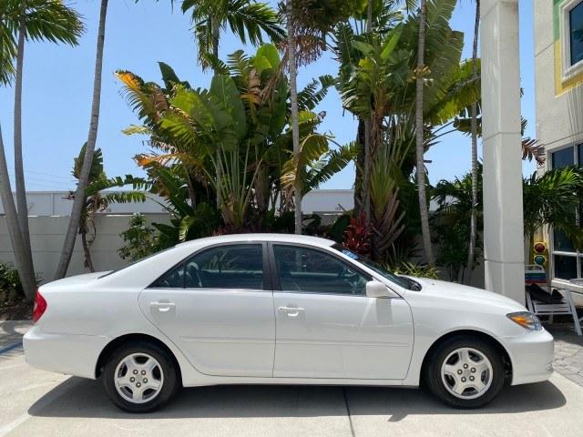 2003 Super White /Stone Toyota Camry LE LOW MILES 61,005 (4T1BF32K63U) with an 3.0L DOHC 24-Valve V6 Engine engine, Automatic transmission, located at 4701 North Dixie Hwy, Pompano Beach, FL, 33064, (954) 422-2889, 26.240938, -80.123474 - OUR WEBPAGE FLORIDACARS1.COM HAS OVER 100 PHOTOS AND FREE CARFAX LINK 2003 Toyota Camry LE Sedan 4 DR 3.0L V6 F DOHC 24V Gasoline 28 MPG Front Wheel Drive Features ABS Brakes Air Conditioning Alloy Wheels AM/FM Stereo Automatic Transmission Cassette Player CD Audio Cloth Seats Cruise Control Power L- Photo#98