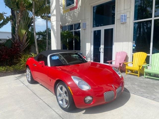 2007 Aggressive (Victory Red) /Ebony Pontiac Solstice LOW MILES 38,147 5SPD AC (1G2MB35B77Y) with an Ecotec 2.4L VVT DOHC 4-Cyl SFI Aluminum Engine engine, Manual transmission, located at 4701 North Dixie Hwy, Pompano Beach, FL, 33064, (954) 422-2889, 26.240938, -80.123474 - OUR WEBPAGE FLORIDACARS1.COM HAS OVER 100 PHOTOS AND FREE CARFAX LINK 2007 Pontiac Solstice Convertible 2.4L I4 F DOHC Gasoline 28 MPG Rear Wheel Drive Features Air Conditioning Alloy Wheels AM/FM Stereo Auxiliary Audio Input CD Audio Cruise Control Leather Seats Manual Transmission Power Locks Powe- Photo#1