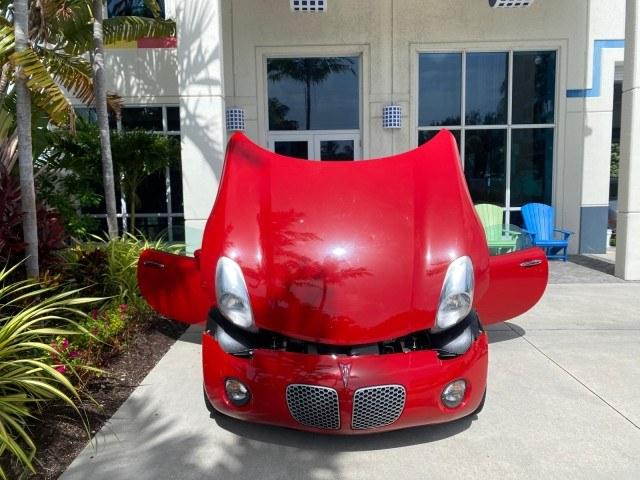 2007 Aggressive (Victory Red) /Ebony Pontiac Solstice LOW MILES 38,147 5SPD AC (1G2MB35B77Y) with an Ecotec 2.4L VVT DOHC 4-Cyl SFI Aluminum Engine engine, Manual transmission, located at 4701 North Dixie Hwy, Pompano Beach, FL, 33064, (954) 422-2889, 26.240938, -80.123474 - OUR WEBPAGE FLORIDACARS1.COM HAS OVER 100 PHOTOS AND FREE CARFAX LINK 2007 Pontiac Solstice Convertible 2.4L I4 F DOHC Gasoline 28 MPG Rear Wheel Drive Features Air Conditioning Alloy Wheels AM/FM Stereo Auxiliary Audio Input CD Audio Cruise Control Leather Seats Manual Transmission Power Locks Powe- Photo#16