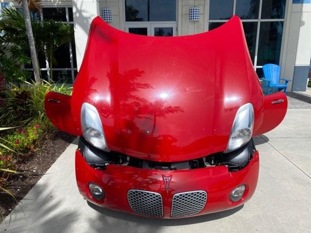 2007 Aggressive (Victory Red) /Ebony Pontiac Solstice LOW MILES 38,147 5SPD AC (1G2MB35B77Y) with an Ecotec 2.4L VVT DOHC 4-Cyl SFI Aluminum Engine engine, Manual transmission, located at 4701 North Dixie Hwy, Pompano Beach, FL, 33064, (954) 422-2889, 26.240938, -80.123474 - OUR WEBPAGE FLORIDACARS1.COM HAS OVER 100 PHOTOS AND FREE CARFAX LINK 2007 Pontiac Solstice Convertible 2.4L I4 F DOHC Gasoline 28 MPG Rear Wheel Drive Features Air Conditioning Alloy Wheels AM/FM Stereo Auxiliary Audio Input CD Audio Cruise Control Leather Seats Manual Transmission Power Locks Powe- Photo#17