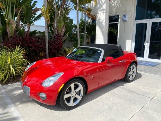 2007 Aggressive (Victory Red) /Ebony Pontiac Solstice LOW MILES 38,147 5SPD AC (1G2MB35B77Y) with an Ecotec 2.4L VVT DOHC 4-Cyl SFI Aluminum Engine engine, Manual transmission, located at 4701 North Dixie Hwy, Pompano Beach, FL, 33064, (954) 422-2889, 26.240938, -80.123474 - OUR WEBPAGE FLORIDACARS1.COM HAS OVER 100 PHOTOS AND FREE CARFAX LINK 2007 Pontiac Solstice Convertible 2.4L I4 F DOHC Gasoline 28 MPG Rear Wheel Drive Features Air Conditioning Alloy Wheels AM/FM Stereo Auxiliary Audio Input CD Audio Cruise Control Leather Seats Manual Transmission Power Locks Powe- Photo#28